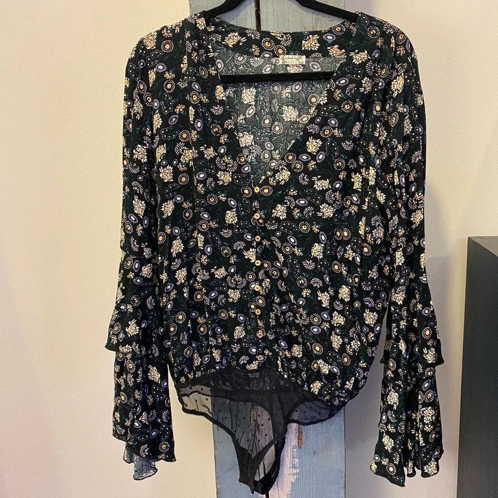 Free People bodysuit with sheer lace snap closure thong. Beautiful flowy sleeves - Picture 1 of 7